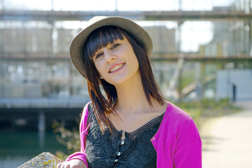 Wall Mural - young smiling brunette girl, outdoors