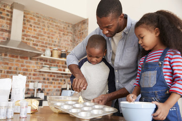 Wall Mural - Father And Children Baking Cakes In Kitchen Together