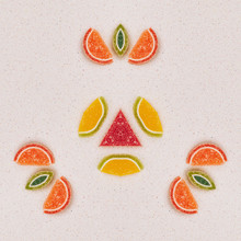 Mandala Made From Fruit Made From Marmalade. The Pattern Is On The Gray Table Top. View From Above