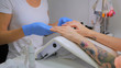 © zyabich - Preparing nail to manicure, master use special spray for client nails in salon