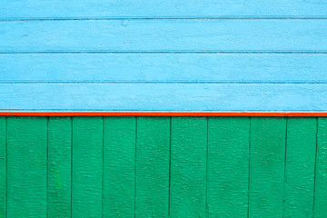 Wall Mural - Vintage green and blue wood background with Red stripe