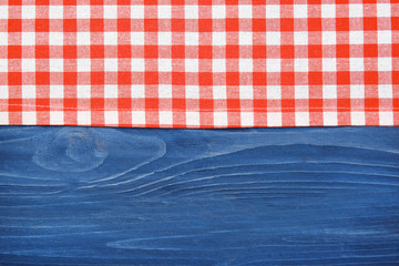 Wall Mural - Red napkin on wooden table