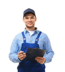 Young plumber in uniform holding clipboard on white background