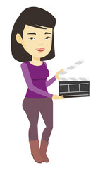 Sticker - Smiling woman holding an open clapperboard.