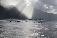 Group Of Surfers Waiting For A Wave, Tahiti