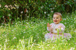 © ververidis - Beautiful baby girl among spring flowers