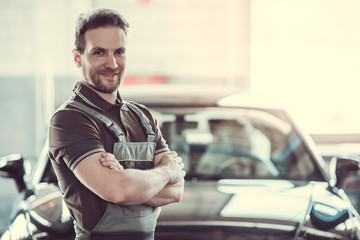 Handsome auto service worker