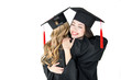© LIGHTFIELD STUDIOS - attractive happy students in graduation caps hugging isolated on white