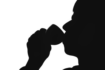 silhouette of a man drinking coffee