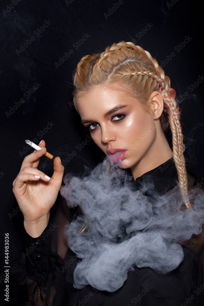 gorgeous pretty woman smoking cigarette Beautiful Woman smoking cigarette Stock Photo