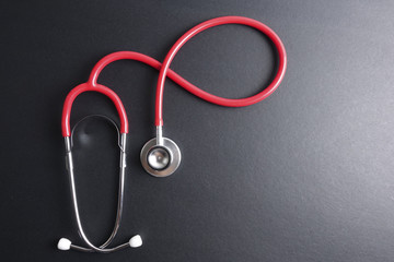 Wall Mural - Red stethoscope,keyboard ,puzzle and coins. Medical concept.