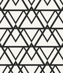 Modern stylish monochrome geometric background in trendy outlined hipster style. Repeating texture with irregular structure of triangles lined up into stylized mountain range. Vector seamless pattern.