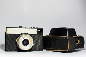 Old Camera with black leather case on a white background