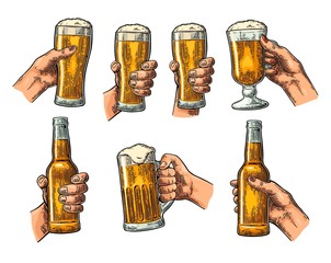 Wall Mural - Man and woman hands holding, clinking with beer glass, bottle