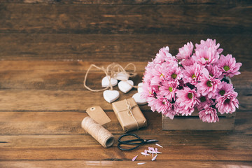 Canvas Print - Flowers and decoration over wooden background