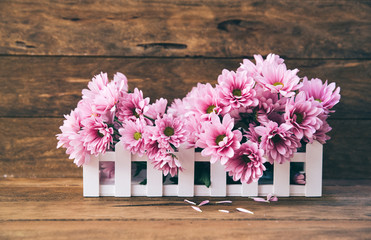 Canvas Print - Holiday background with garden flowers on wooden table