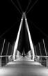 Pedestrian bridge at night. Graphical architectural structure