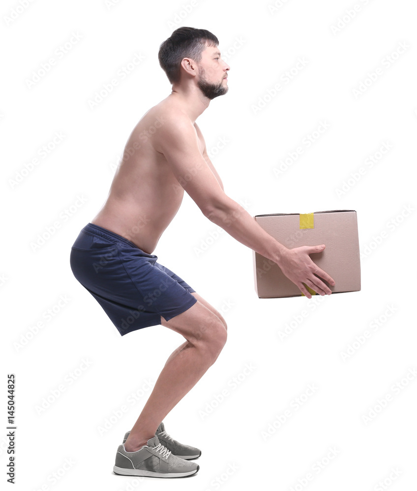 Posture concept. Man lifting heavy cardboard box against white background