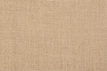 A background of a scratchy burlack material in an even light brown color.