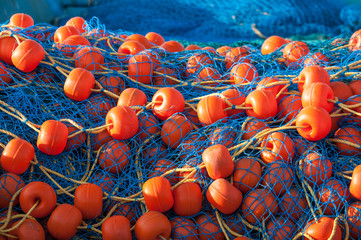 Bright fishing net with floats closeup