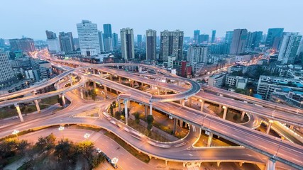 Wall Mural - time lapse of city interchange road in nightfall, beautiful chengdu overpass at dusk to night
