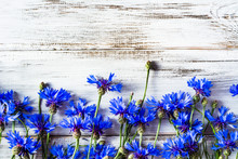 Blue Flowers, Summer Wildflowers On Wooden Background, Overhead