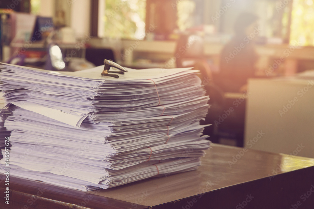 Business Concept, Pile of unfinished documents on office desk, Stack of business paper, Vintage Effect