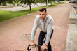 © Syda Productions - young man riding bicycle on city street