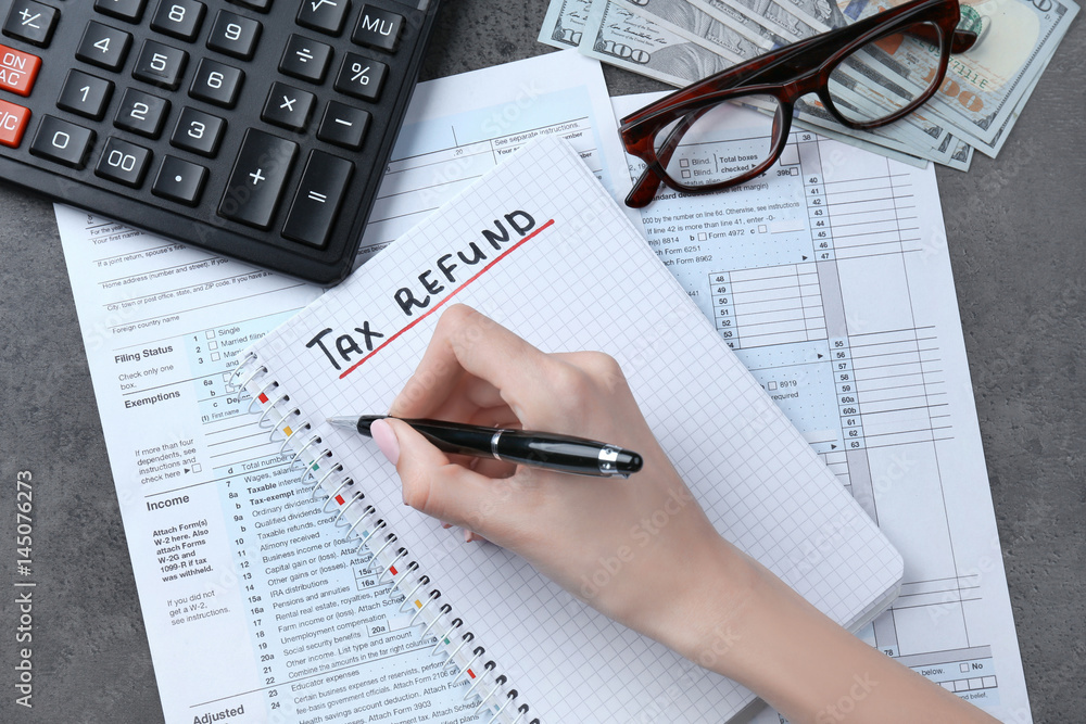 Woman making notes in notebook, closeup