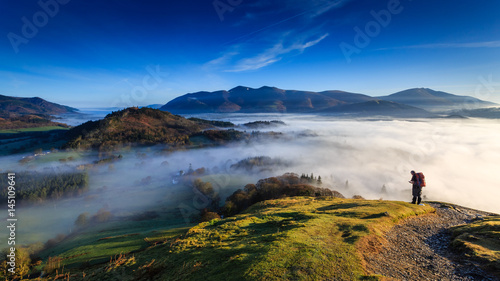 Cuadros en Lienzo Fell walker ascending Catbells, The Lake District, Cumbria, England