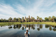 Woman looking Angkor Wat Temple.
