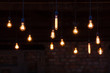 © Angelov - Luxury retro light bulb glowing Vintage style light bulbs hanging from the ceiling Many decorative light bulbs
