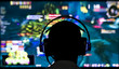 © sezer66 - Young gamer playing video game wearing headphone.