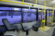 Interior Of Modern City Trolley Bus In Front Part In Night