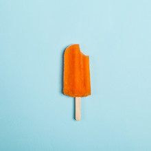 Tasty And Refreshing Popsicles On Blue Background