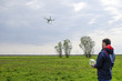 © eleonimages - A man with a remote control in his hands. Flight control of the drone. Phantom