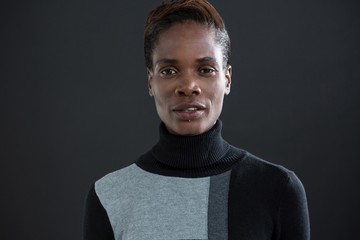 Androgynous person against grey background