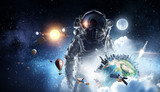 Fototapeta Kosmos - Astronaut in outer space. Mixed media . Mixed media