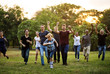 © Rawpixel.com - Group of people walking and running playful in the park