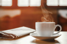 Coffee Cup With Newspaper On The Table, Coffee Shop Background, Warm Tone