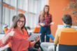 © FS-Stock - happy young business woman with her staff, people group in background at modern bright office indoors