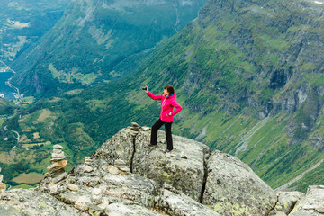 Poster - Tourist taking photo from Dalsnibba viewpoint Norway