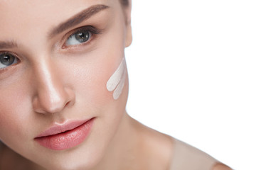 Wall Mural - skin care. sexy girl with foundation or cosmetic cream on face