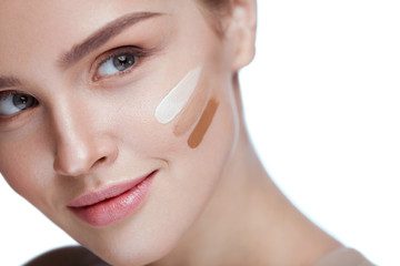 Wall Mural - skin care. sexy girl with foundation cream on beauty face