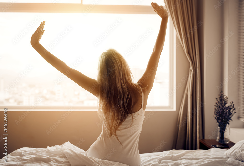 Young woman wake up in bedroom. - obrazy, fototapety, plakaty 