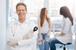 © zinkevych - Amused young patient enjoying conversation with doctor in the hospital