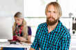 © Sergey Nivens - Young man working in office