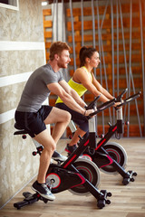 Wall Mural - Couple trains on bike in gym