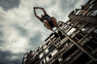 © Coka - young man doing   parkour jump  in the city