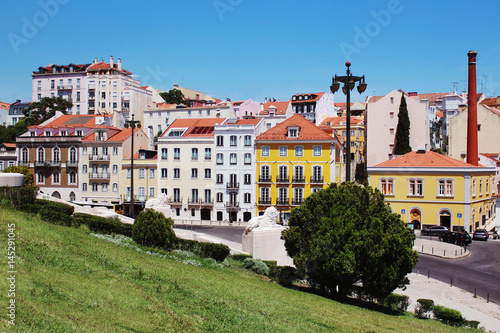 Lisbon architecture. Colorful houses against the blue sky Canvas Print
